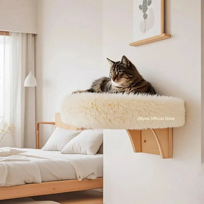 Wall mounted wooden cat bed with soft cushion and sturdy hardwood frame attached to wall in cozy bedroom