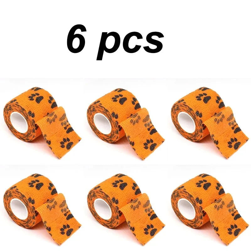 Load image into Gallery viewer, Eco-Friendly Pet Paw Wraps 6-Pack, self-adhesive bandages with paw prints, orange color, biodegradable material.
