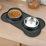 Anti-slip mat with durable stainless steel water and food feeder bowls for pets.