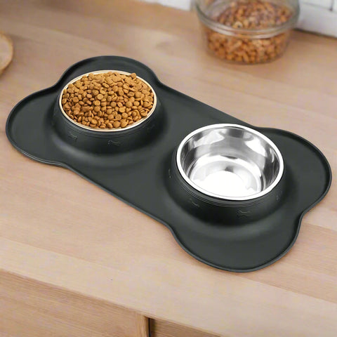 Anti-slip mat with durable stainless steel water and food feeder bowls for pets.